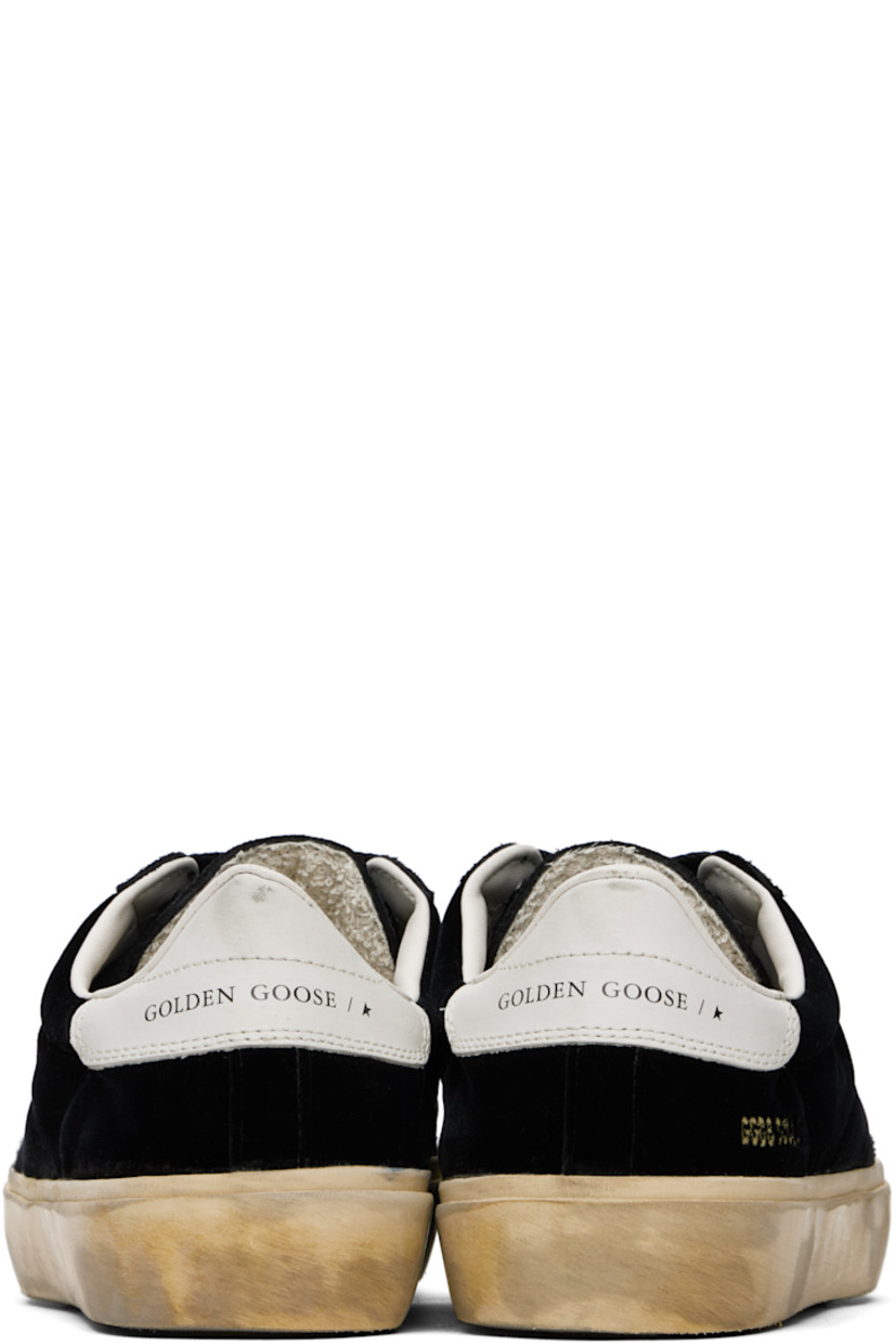 Handcrafted low-top suede and velvet sneakers in black. 

· Smudging and subtle distressing throughout
· Lace-up closure
· Logo embossed at padded tongue
· Padded collar
· Topstitched stripes at sides
· Logo flag and stamp at outer side
· Logo printed at buffed leather heel tab
· Buffed faux-leather and terrycloth lining
· Treaded rubber sole

Supplier color: Black