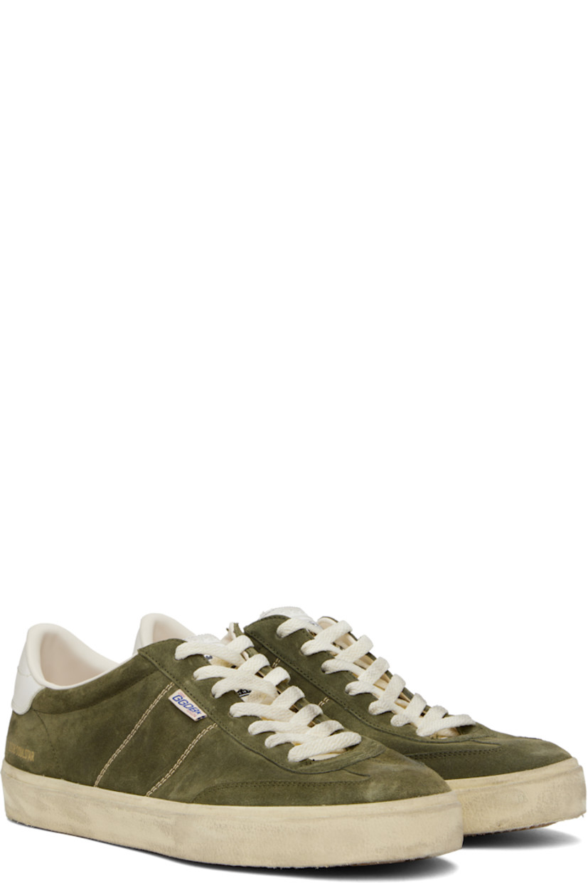 Handcrafted low-top suede sneakers in khaki.

· Smudging and subtle distressing throughout
· Lace-up closure
· Logo embossed at padded tongue
· Padded collar
· Topstitched stripes at sides
· Logo flag and stamp at outer side
· Logo printed at buffed leather heel tab
· Buffed faux-leather and terrycloth lining
· Treaded rubber sole

Supplier color: Military-green/White/Milk-white