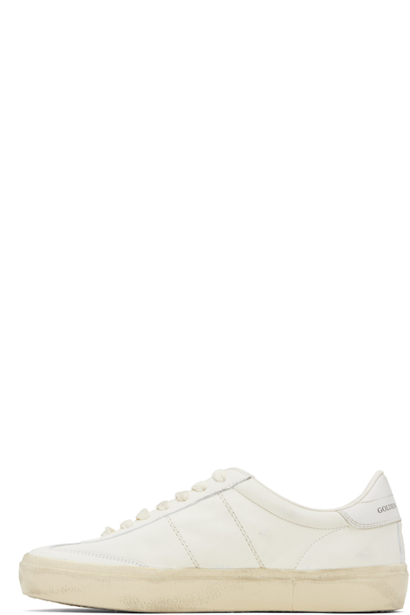 Handcrafted low-top nappa sheepskin sneakers in white. 

· Smudging and subtle distressing throughout
· Lace-up closure
· Logo embossed at padded tongue
· Padded collar
· Topstitched stripes at sides
· Logo flag and stamp at outer side
· Logo printed at buffed leather heel tab
· Buffed faux-leather and terrycloth lining
· Treaded rubber sole

Supplier color: White/Milk