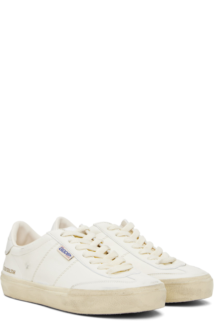 Handcrafted low-top nappa sheepskin sneakers in white. 

· Smudging and subtle distressing throughout
· Lace-up closure
· Logo embossed at padded tongue
· Padded collar
· Topstitched stripes at sides
· Logo flag and stamp at outer side
· Logo printed at buffed leather heel tab
· Buffed faux-leather and terrycloth lining
· Treaded rubber sole

Supplier color: White/Milk