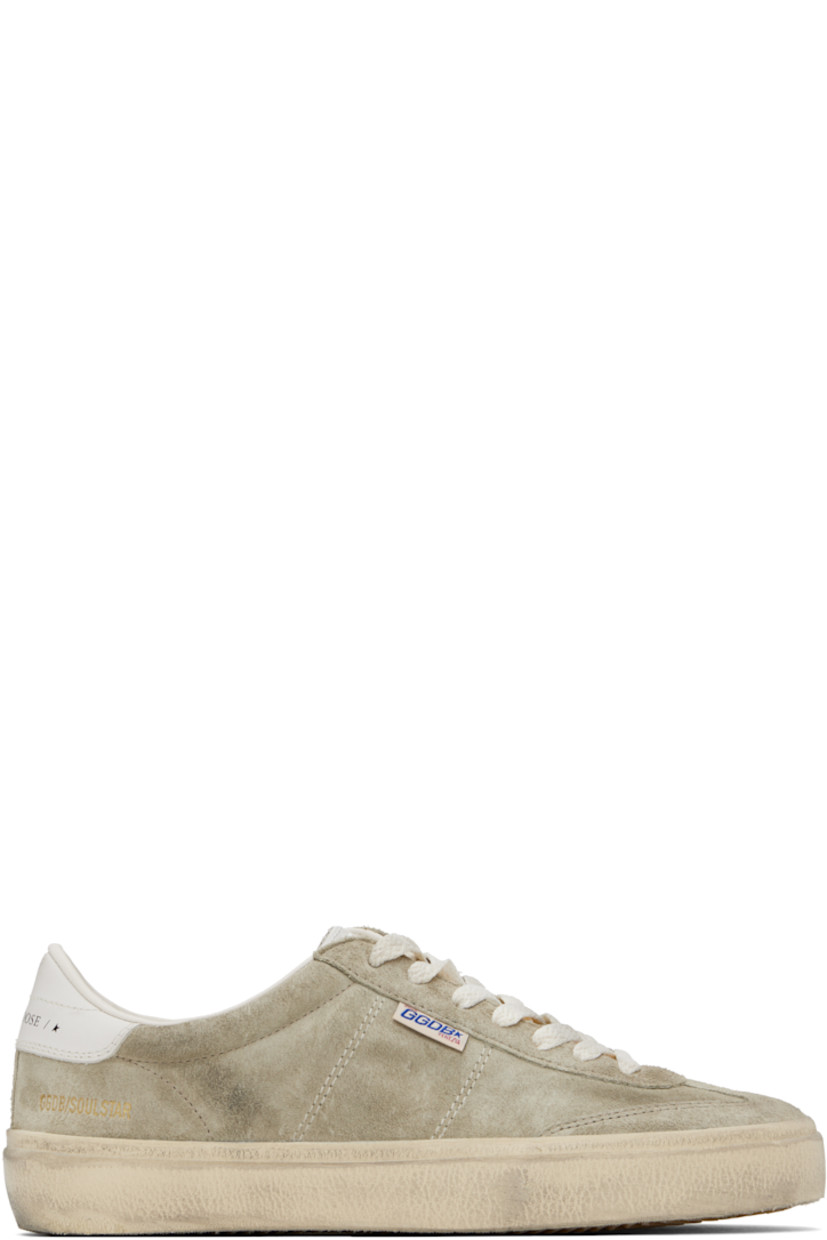 Handcrafted low-top suede sneakers in gray.

· Smudging and subtle distressing throughout
· Lace-up closure
· Logo embossed at padded tongue
· Padded collar
· Topstitched stripes at sides
· Logo flag and stamp at outer side
· Logo printed at buffed leather heel tab
· Buffed faux-leather and terrycloth lining
· Treaded rubber sole

Supplier color: Dove-gray/Milk-white/Cream