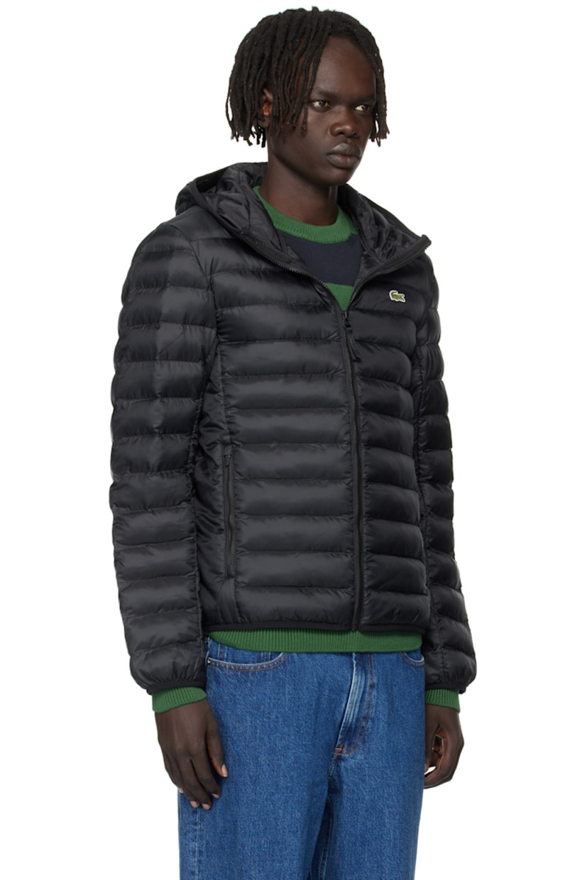 Insulated and quilted satin jacket. 

· Zip closure
· Embroidered logo patch at chest
· Zip pockets at front 
· Full satin lining

Supplier color: Black