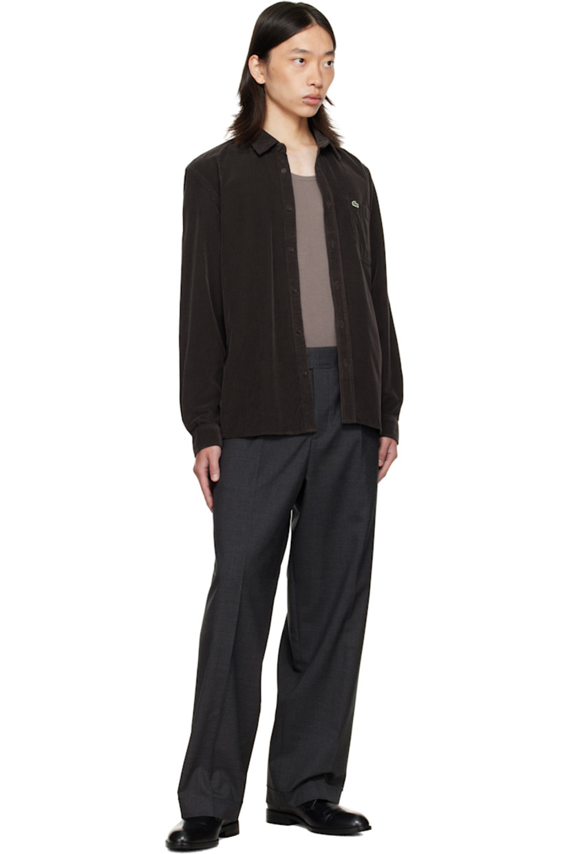 Cotton corduroy shirt.

· Spread collar
· Button closure
· Logo patch and patch pocket at chest
· Shirttail hem
· Buttoned barrel cuffs
· Pleats at back yoke

Supplier color: Port