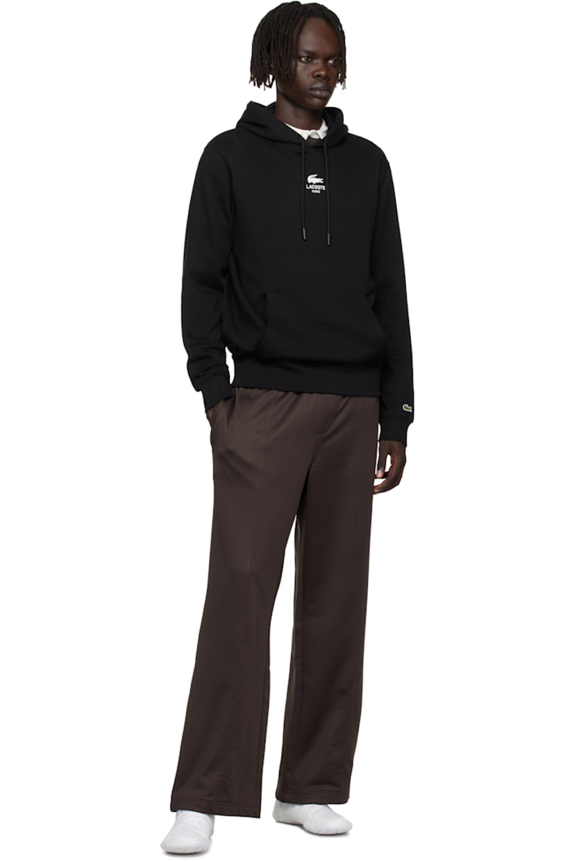 Cotton French terry hoodie.

· Drawstring at hood
· Logo printed at chest and back
· Kangaroo pocket at waist 
· Rib-knit hem and cuffs
· Embroidered logo patch at cuff

Supplier color: Black