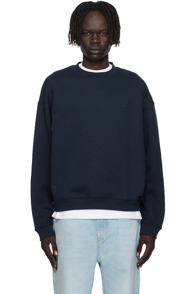 French terry sweatshirt. 

· Rib-knit crewneck, hem, and cuffs
· Embroidered logo patch at chest 
· Dropped shoulders

Supplier color: Navy blue