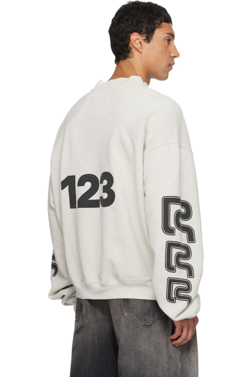 Handcrafted brushed cotton French terry sweatshirt.

· Rib-knit crewneck, hem, and cuffs
· Logo printed at chest and sleeves
· Logo patch at front hem
· Dropped shoulders
· Text printed at back

Supplier color: Heather grey