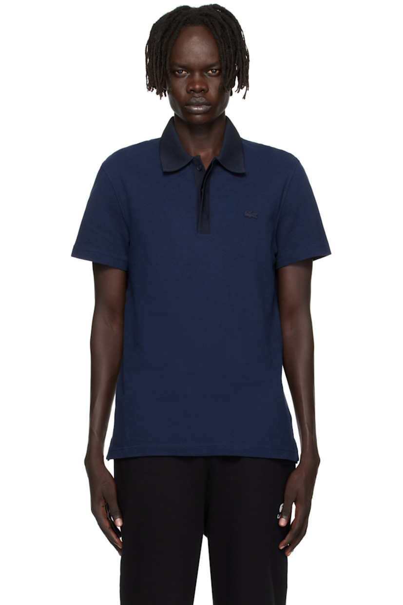 Lightweight organic cotton piqué polo.

· Knit spread collar and placket
· Concealed three-button placket
· Embroidered logo patch at chest
· Vented side seams
· Logo-engraved hardware

Supplier color: Navy blue/Abysm