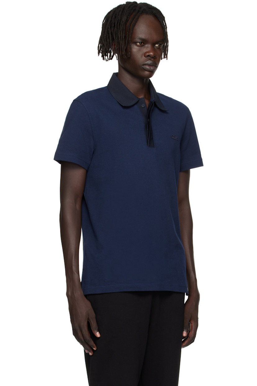 Lightweight organic cotton piqué polo.

· Knit spread collar and placket
· Concealed three-button placket
· Embroidered logo patch at chest
· Vented side seams
· Logo-engraved hardware

Supplier color: Navy blue/Abysm