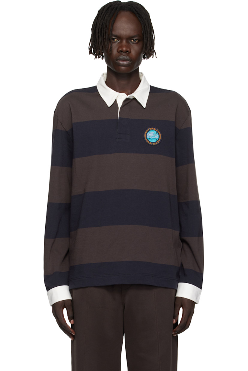 Heavyweight organic cotton jersey polo.

· Striped throughout
· Twill spread collar and cuffs
· Three-button placket
· Embroidered logo graphic patch at chest
· Vented side seams
· Buttoned barrel cuffs
· Embroidered logo patch at back collar
· Logo-engraved hardware

Supplier color: Navy blue/Brown