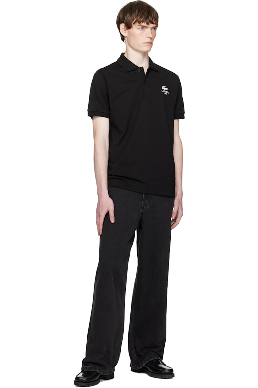 Cotton piqué polo.

· Rib-knit spread collar and cuffs
· Two-button placket
· Logo printed at chest
· Vented side seams
· Embroidered logo patch at back collar

Supplier color: Black