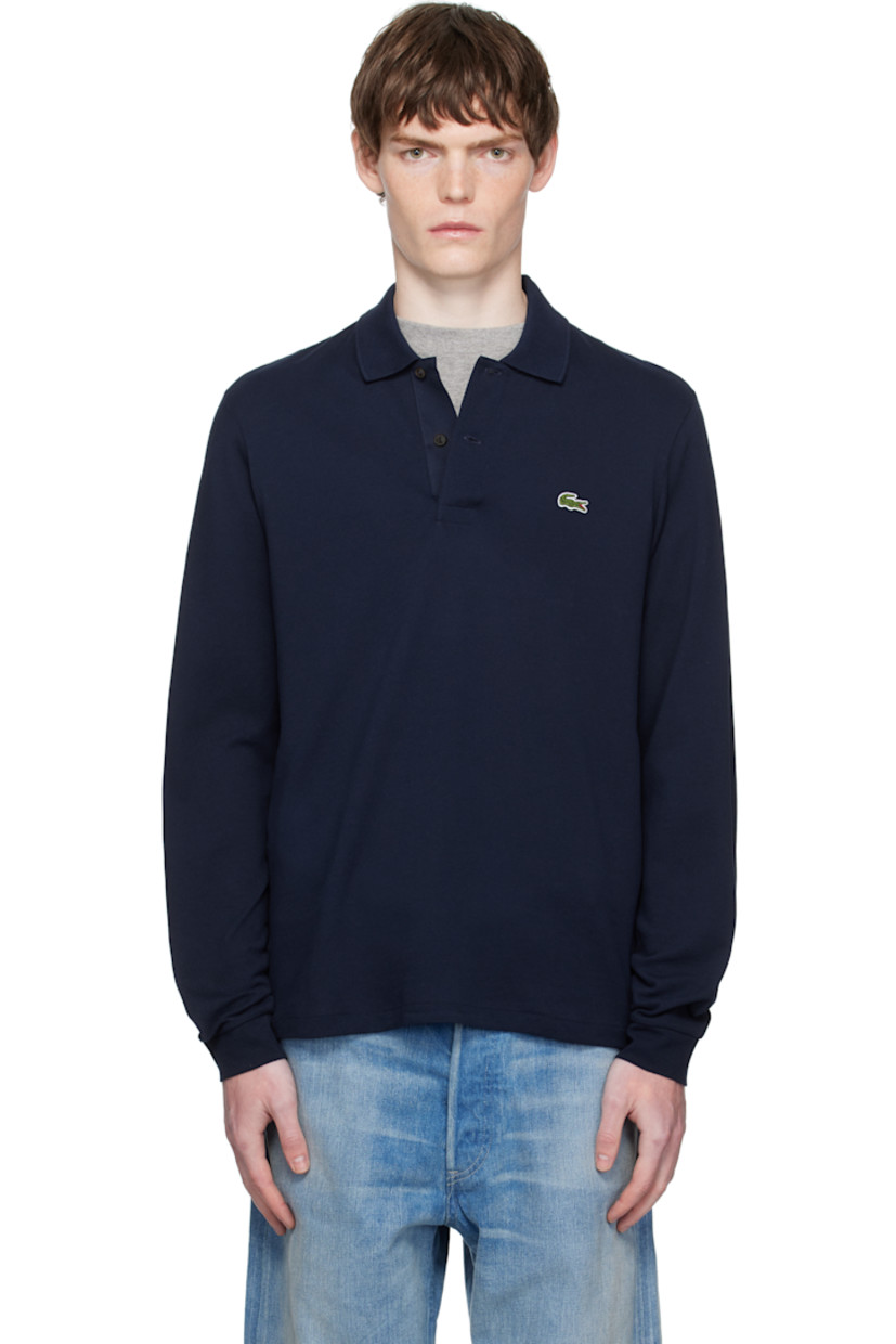 Cotton piqué polo.

· Rib-knit spread collar
· Two-button placket
· Embroidered logo patch at chest
· Jersey cuffs
· Mother-of-pearl hardware

Supplier color: Navy blue