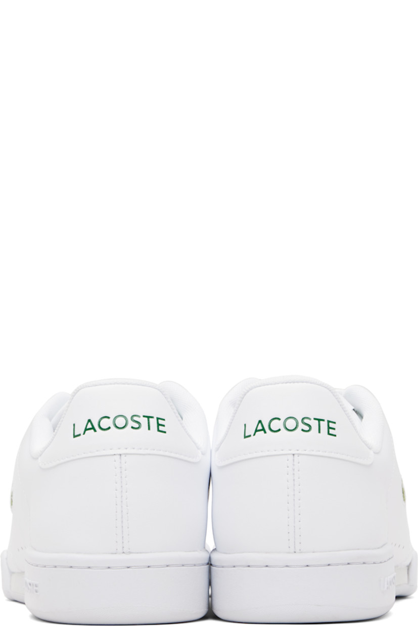 Low-top buffed leather sneakers.

· Lace-up closure
· Logo patch at woven padded tongue
· Padded collar
· Perforations at sides
· Logo embroidered at outer side
· Logo embossed at heel tab
· Treaded rubber sole

Supplier color: White/White