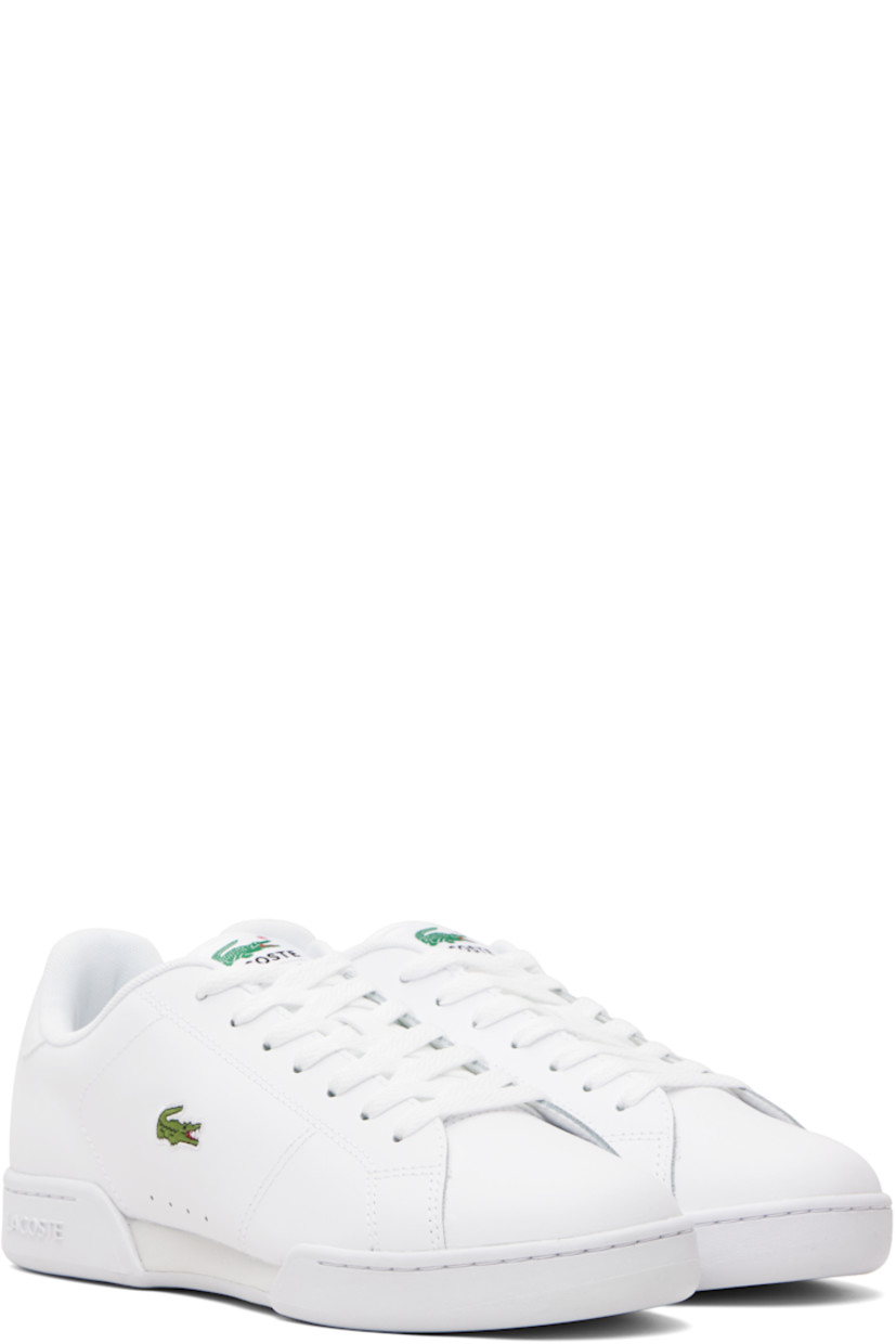 Low-top buffed leather sneakers.

· Lace-up closure
· Logo patch at woven padded tongue
· Padded collar
· Perforations at sides
· Logo embroidered at outer side
· Logo embossed at heel tab
· Treaded rubber sole

Supplier color: White/White