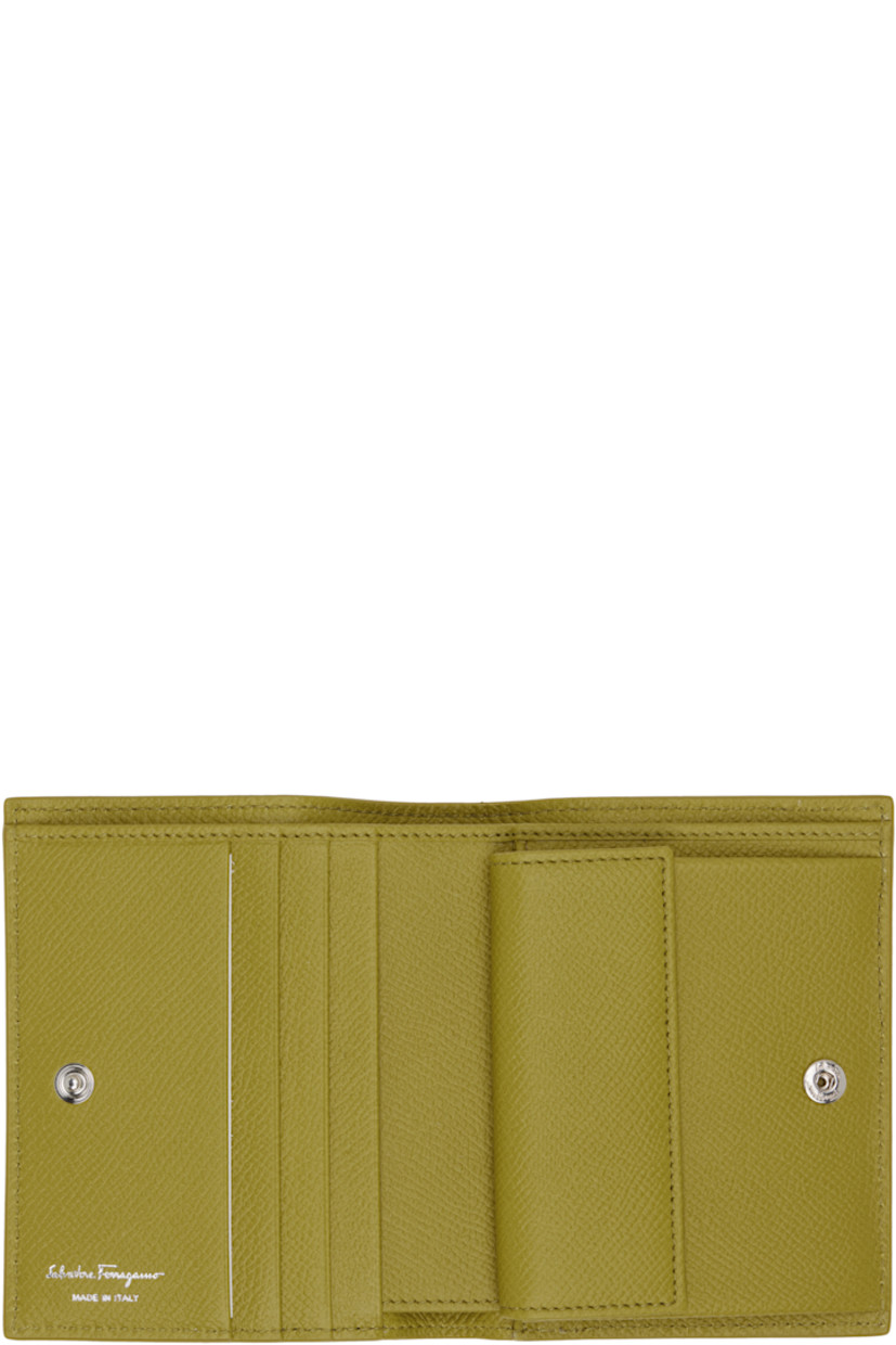 Hammered calfskin bifold wallet. 

· Logo hardware at face
· Press-stud closure
· Four card slots and coin compartment at interior 
· One note slot and patch pocket 
· Calfskin interior
· Canvas lining
· H4.5" x W3.5" x D1"

Supplier color: Lemongrass