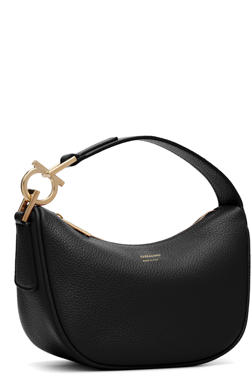 Grained calfskin shoulder bag.

· Logo hardware at fixed shoulder strap
· Logo stamp at face
· Zip closure
· Twill lining
· H5.5" x W8" x D3.5"

Supplier color: Black