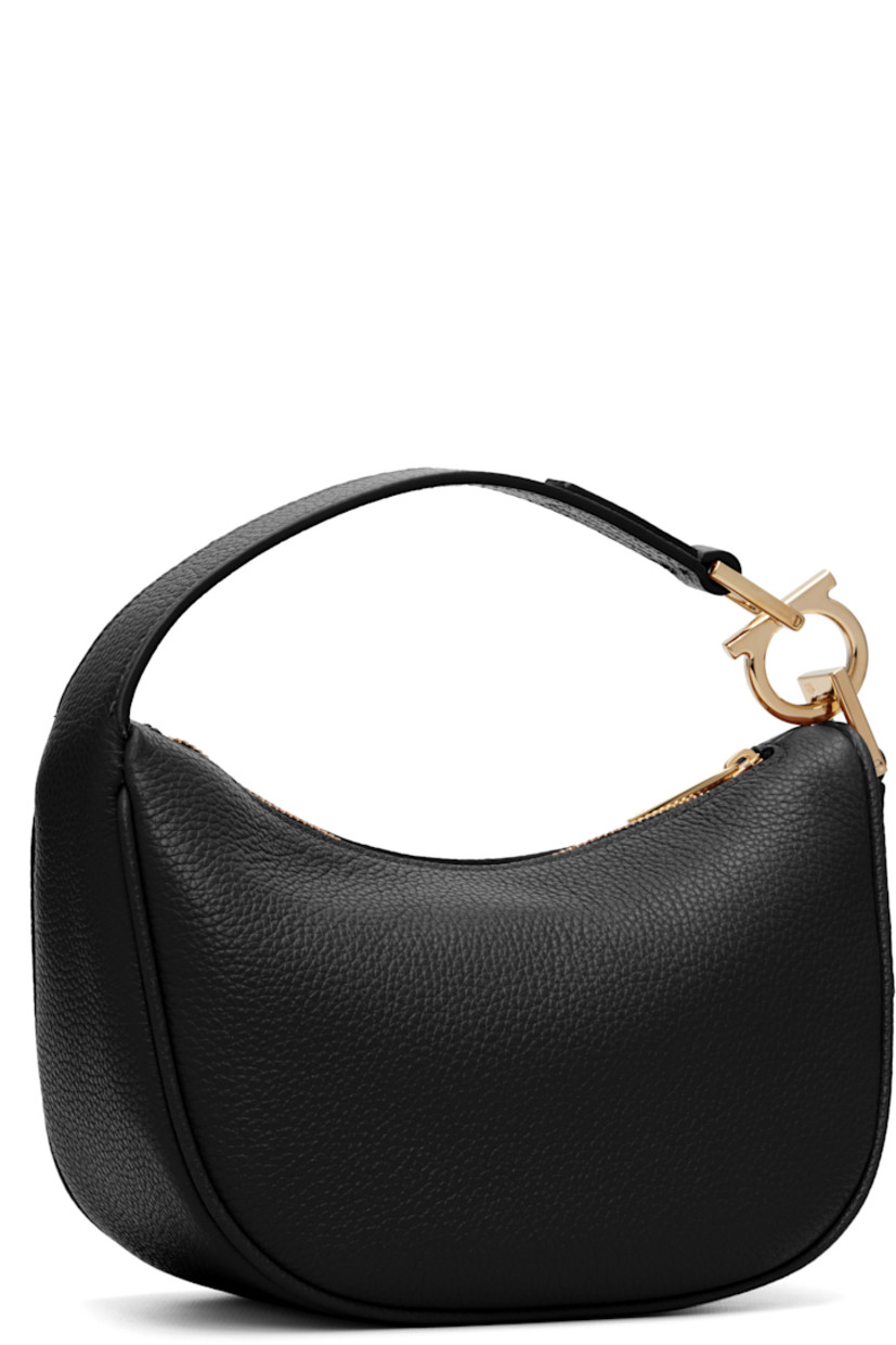 Grained calfskin shoulder bag.

· Logo hardware at fixed shoulder strap
· Logo stamp at face
· Zip closure
· Twill lining
· H5.5" x W8" x D3.5"

Supplier color: Black