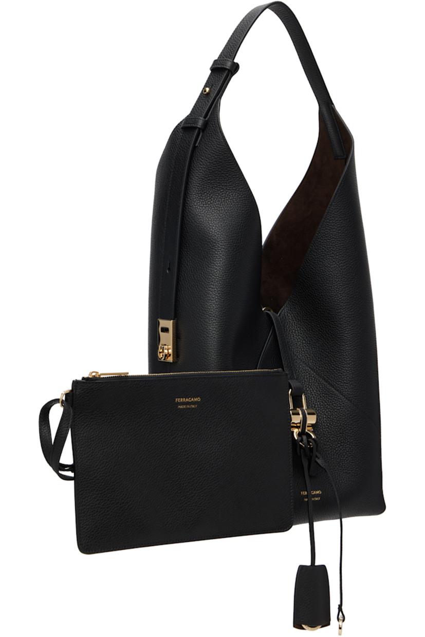 Hammered calfskin tote.

· Adjustable carry handle
· Logo stamp at face
· Detachable sheathed key ring at tab-slot strap
· Detachable zip pouch at interior
· Suede lining
· Gold-tone hardware
· H16" x W10.5" x D5"

Supplier color: Black
