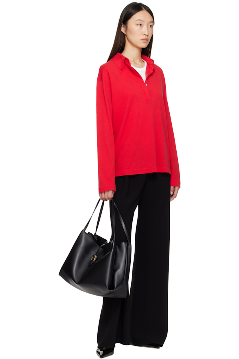Grained calfskin tote.

· Twin fixed shoulder straps
· Accordion panel at sides
· Logo hardware at magnetic fastening 
· Zip pocket at interior 
· Twill lining
· H11" x W14.5" x D6"

Supplier color: Black