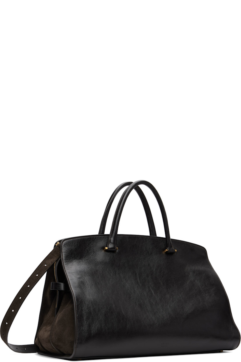 Vegetable-tanned and grained buffalo leather tote. Detachable interior-compartment divider converts to crossbody pouch. 

· Rolled leather carry handles
· Single adjustable and detachable crossbody strap
· Compartment with turn-lock closure at face
· Pen and card slots, pocket, and phone compartment
· Two-way zip closure
· 14" laptop compartment and zip pocket at interior
· Full suede lining
· H10.5" x W16" x D9"

Supplier color: Suede cacao/Chocolate