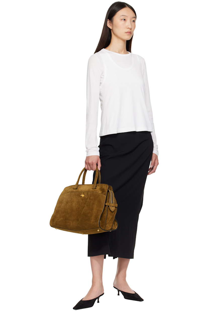 Calfskin suede carryall tote. Detachable interior-compartment divider converts to crossbody pouch. 

· Rolled leather carry handles
· Single adjustable and detachable crossbody strap
· Compartment with turn-lock closure at face
· Pen and card slots, pocket, and phone compartment
· Two-way zip closure
· 13" laptop compartment and zip pocket at interior
· Full suede lining
· H8.5" x W13.5" x D8"

Supplier color: Suede Marrakech