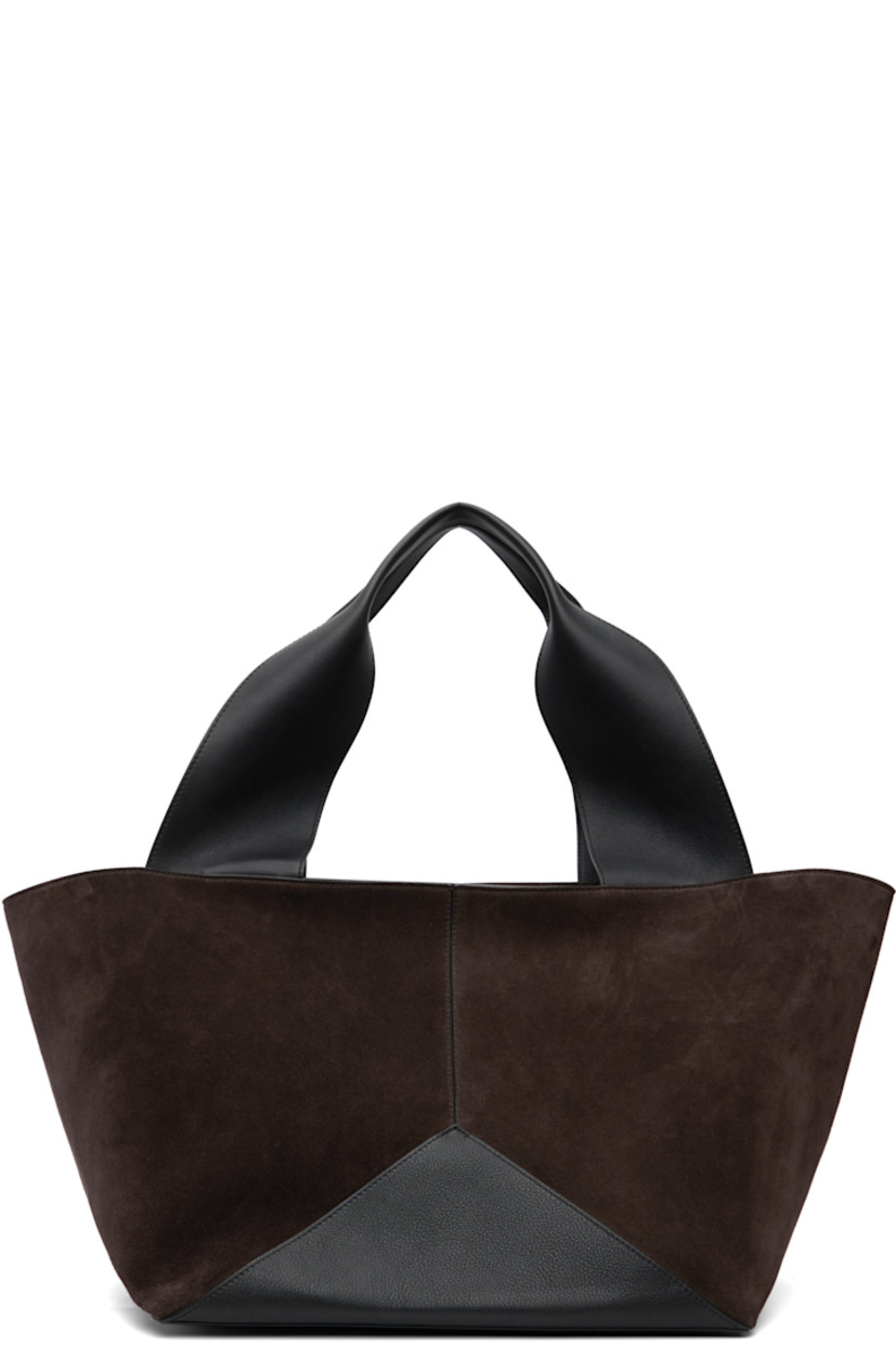 Paneled suede and grained calfskin leather tote.

· Rolled shoulder straps
· Zip closure
· Patch pocket at interior
· Detachable zip pouch with adjustable shoulder strap
· Suede lining
· H13" x W21" x D9.5"

Supplier color: Chocolate/Black