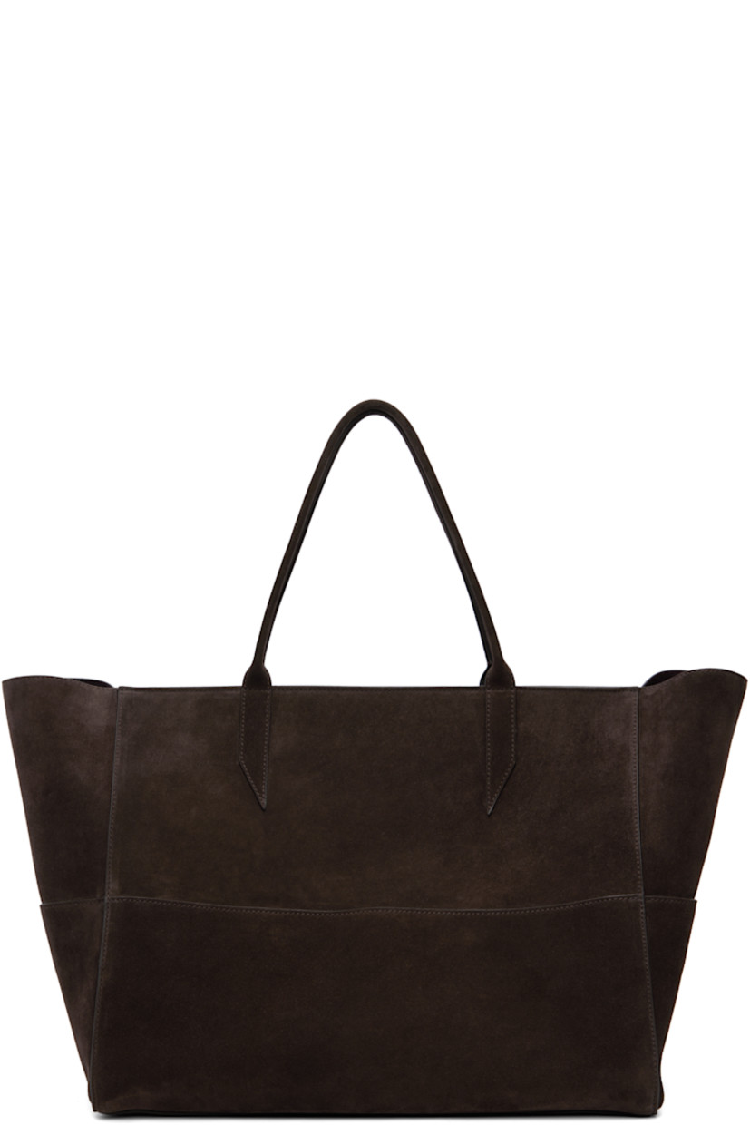 Paneled suede tote.

· Magnetic patch pockets throughout
· Rolled shoulder straps
· Zip closure
· Zip pocket at interior
· Laptop compartment
· Contrast stitching in white
· H13" x W21" x D9.5"

Supplier color: Chocolate