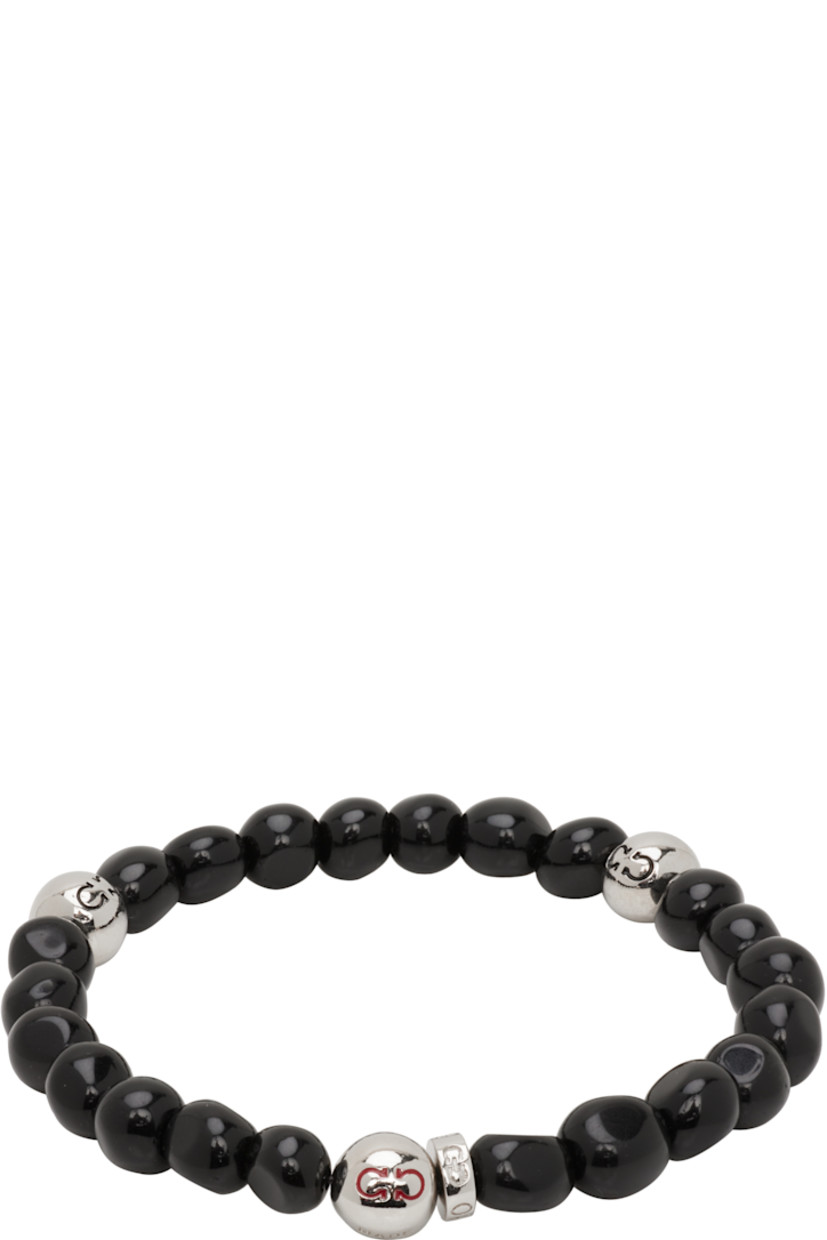 Elasticized beaded stone bracelet in black.

· Logo-engraved silver-tone brass beads
· D2.75"

Supplier color: Black