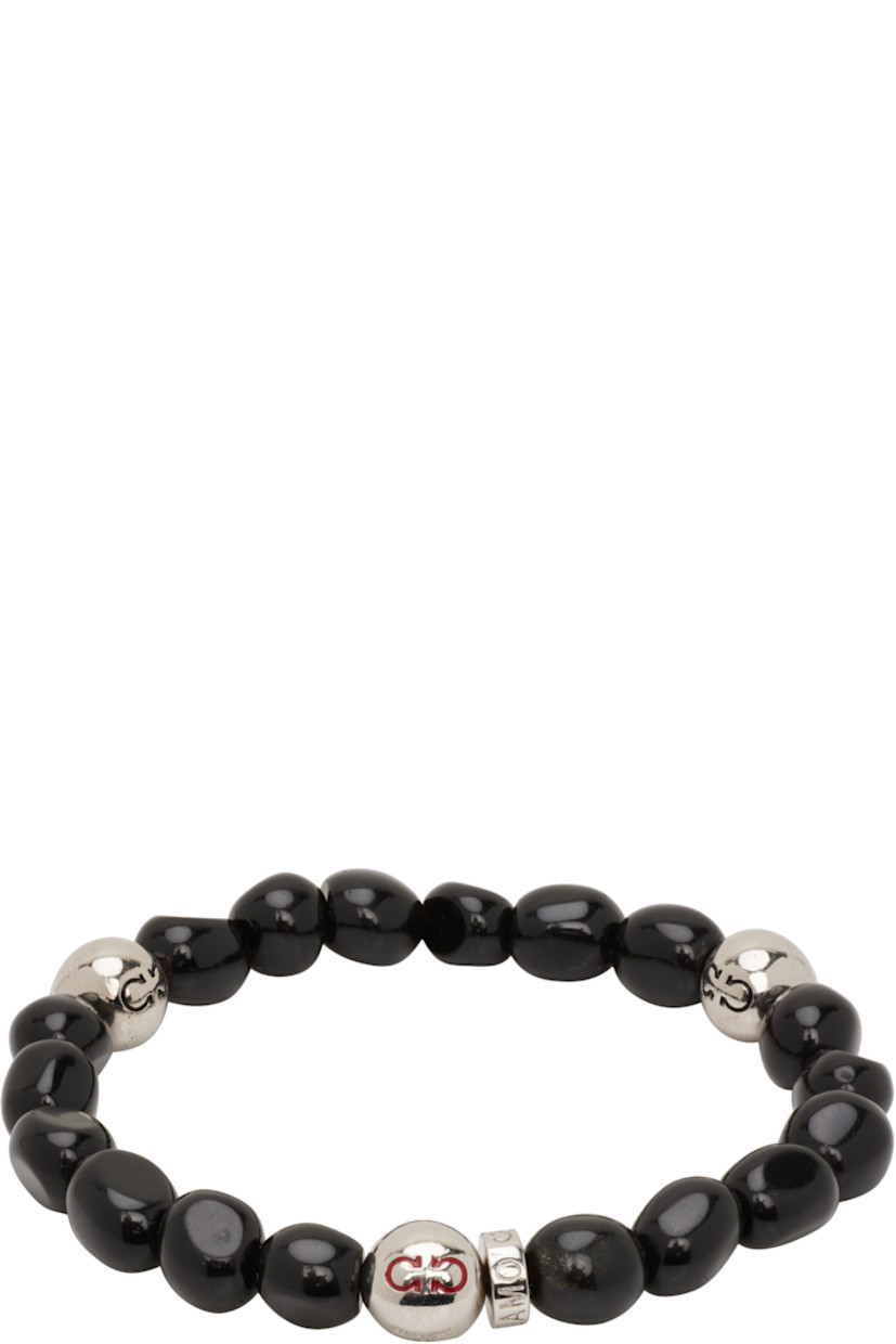 Elasticized beaded stone bracelet in black.

· Logo-engraved silver-tone brass beads
· D2.75"

Supplier color: Black
