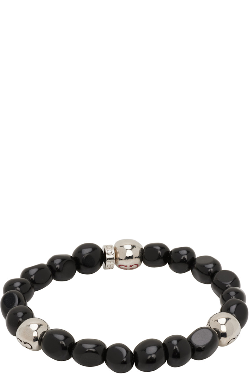 Elasticized beaded stone bracelet in black.

· Logo-engraved silver-tone brass beads
· D2.75"

Supplier color: Black