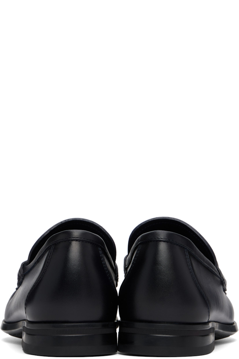 Buffed calfskin loafers.

· Square moc toe
· Logo hardware at vamp
· Calfskin suede lining
· Rubber sole

Supplier color: Navy