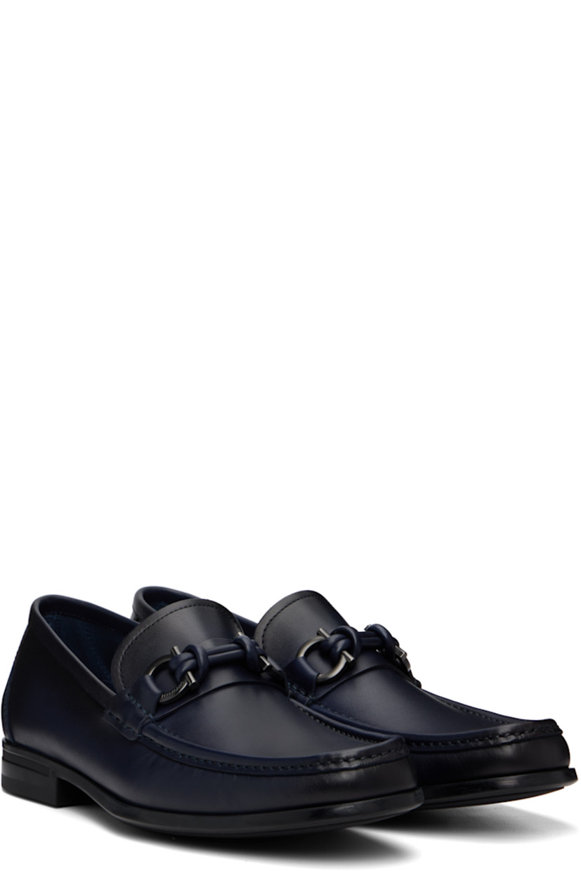 Buffed calfskin loafers.

· Square moc toe
· Logo hardware at vamp
· Calfskin suede lining
· Rubber sole

Supplier color: Navy