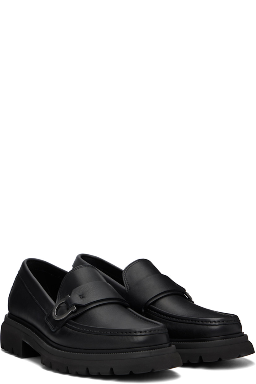 Buffed calfskin loafers.

· Moc toe
· Strap with logo hardware at vamp
· Buffed leather lining
· Treaded rubber sole
· Heel: H1.5"

Supplier color: Black