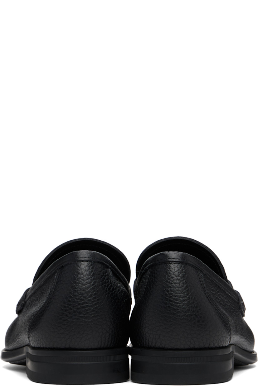 Soft tumbled calfskin loafers.

· Square moc toe
· Logo hardware at vamp
· Calfskin suede lining
· Rubber sole

Supplier color: Black