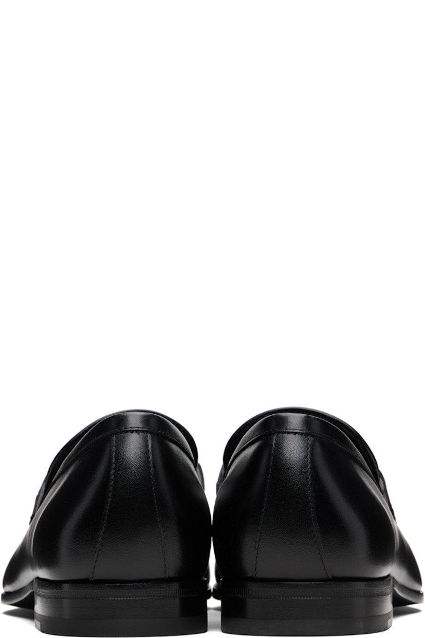 Buffed calfskin loafers.

· Square moc toe
· Logo hardware at vamp
· Buffed leather lining
· Stacked leather heel with rubber injection
· Calfskin sole

Supplier color: Black