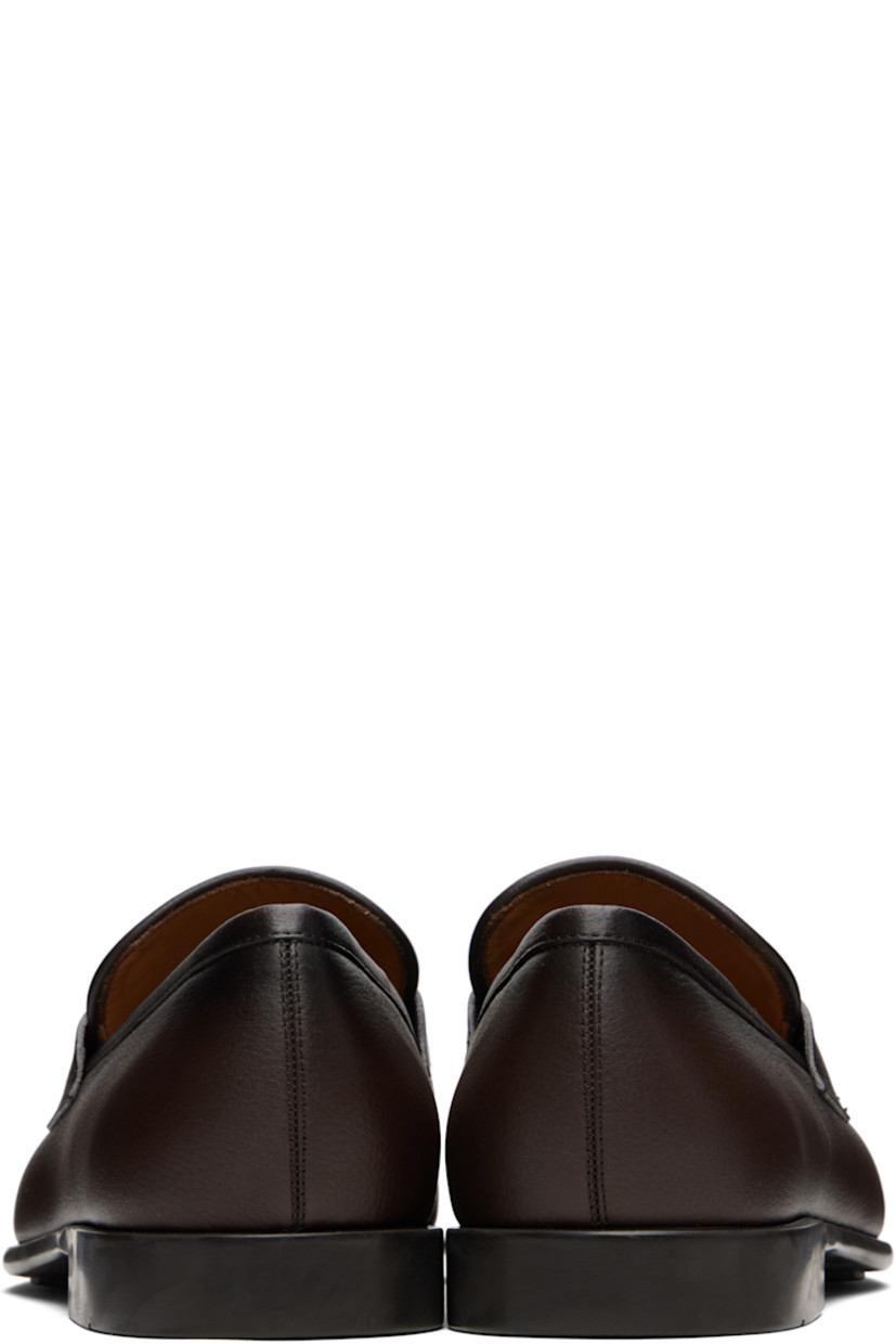 Hammered calfskin loafers.

· Square moc toe
· Logo hardware at vamp
· Buffed leather lining
· Rubber sole

Supplier color: Testa di moro