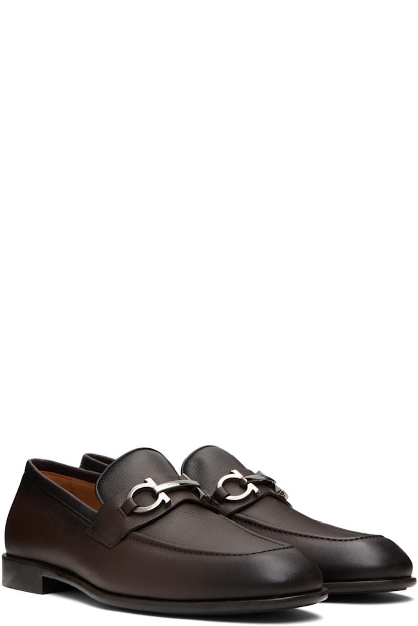 Hammered calfskin loafers.

· Square moc toe
· Logo hardware at vamp
· Buffed leather lining
· Rubber sole

Supplier color: Testa di moro