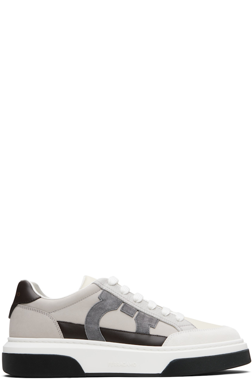 Low-top paneled calfskin suede and buffed calfskin sneakers.

· Lace-up closure
· Logo embossed at padded tongue
· Padded collar
· Logo printed at heel tab
· Logo appliqué at outer side
· Jersey lining
· Logo embossed at rubber midsole
· Treaded rubber sole

Supplier color: White/Mascarpone