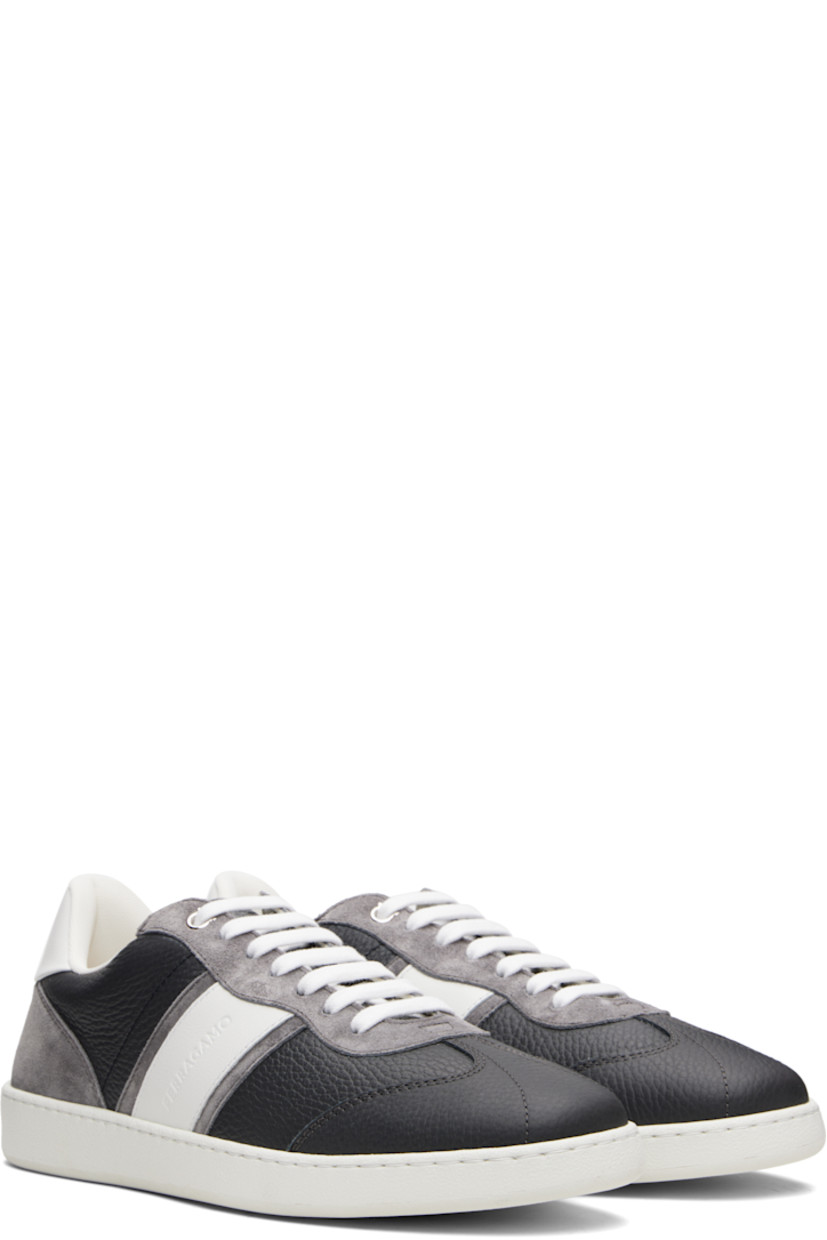 Low-top paneled calfskin suede and grained calfskin sneakers.

· Logo embossed throughout
· Lace-up closure
· Padded tongue and collar
· Logo embossed at heel
· Mesh lining
· Treaded rubber sole

Supplier color: Stromboli Sand/Optic White