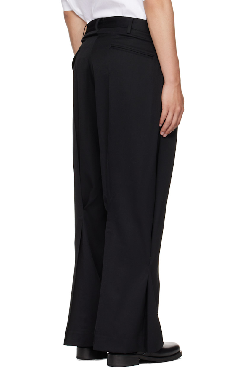 Wool twill trousers.

· Belt loops
· Four-pocket styling
· Zip fly
· Inverted box pleat at front waist
· Tuck pleats at legs

Supplier color: Black