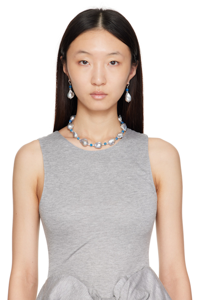 Beaded baroque pearl, agate, and quartz stone necklace.

· Hand-knotted silk thread
· Logo plaque at hook fastening
· Sterling silver hardware
· L15"

Part of the Gohar World Table VII collection.

Supplier color: Gray/Blue