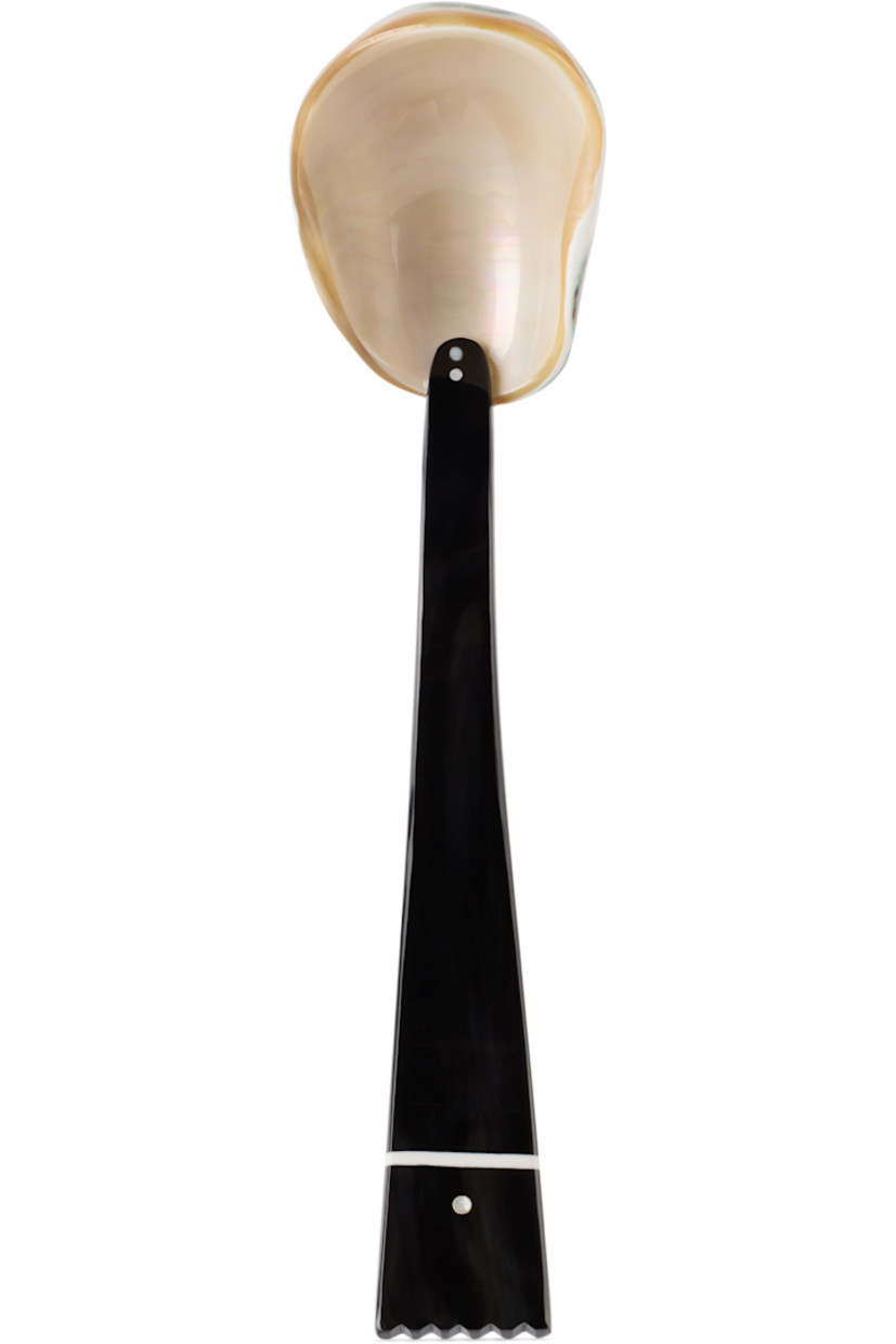 Hand-carved horn serving spoon in black.

· Mother-of-pearl bowl
· Hand wash
· L9" / L22.8 cm

Part of the Table VII collection.

Each item is unique. Please note coloration and finishings may vary slightly.

Supplier color: Mother of pearl