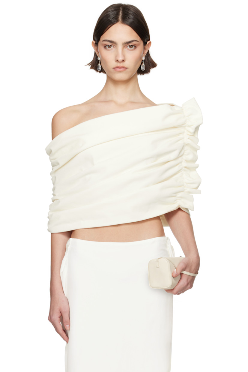Cotton velvet top.

· Off-the-shoulder and asymmetrical construction
· Ruching at sides
· Ruffled trim at side seam
· Full poplin lining

Part of the exclusive SSENSE Bridal capsule.

Supplier color: Ivory