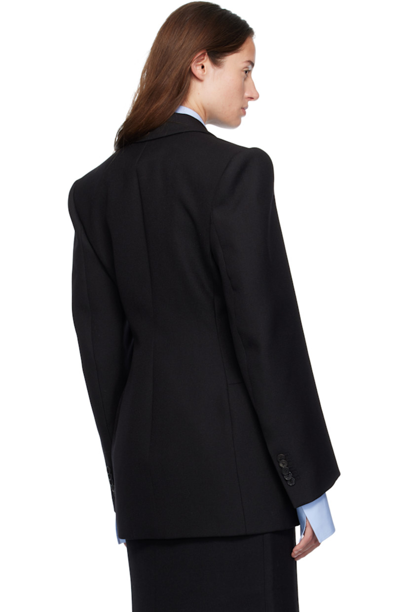 Heavyweight woven virgin wool blazer.

· Peaked lapel
· Double-breasted button closure
· Darts at front
· Flap pockets at waist
· Padded shoulders
· Buttoned surgeon's cuffs
· Buttoned pocket at interior
· Full satin lining

Supplier color: Black