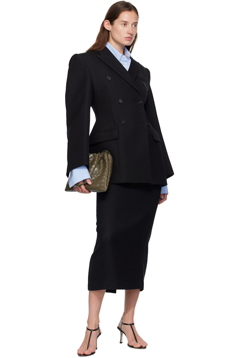 Heavyweight woven virgin wool blazer.

· Peaked lapel
· Double-breasted button closure
· Darts at front
· Flap pockets at waist
· Padded shoulders
· Buttoned surgeon's cuffs
· Buttoned pocket at interior
· Full satin lining

Supplier color: Black