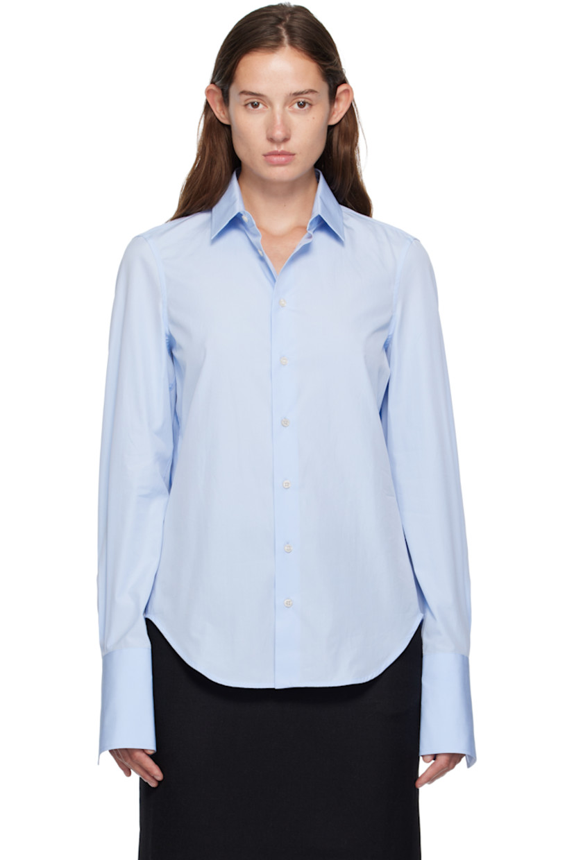 Cotton poplin shirt. 

· Spread collar 
· Button closure 
· Shirttail hem
· Pleats at buttoned barrel cuffs
· Box pleat at back yoke 

Supplier color: Blue