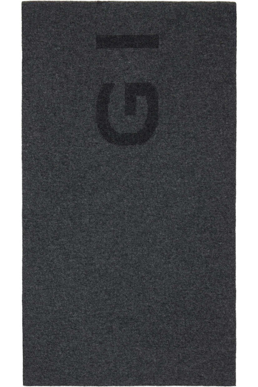 Rectangular knit wool- and cashmere-blend scarf.

· Jacquard logo at face
· Jacquard logo pattern at back face
· L68" x W13"

Supplier color: Grey mix/Charcoal