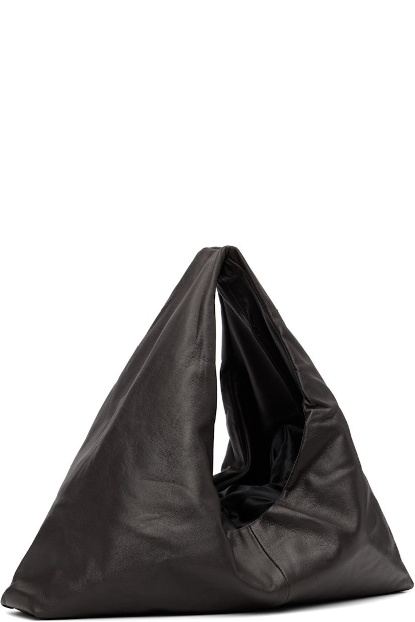 Grained lambskin tote.

· Integrated carry handle
· Bungee-style drawstring closure
· Partial satin twill lining
· H7" x W16.75" x D3"
· Total height: H12"

Supplier color: Dark brown
