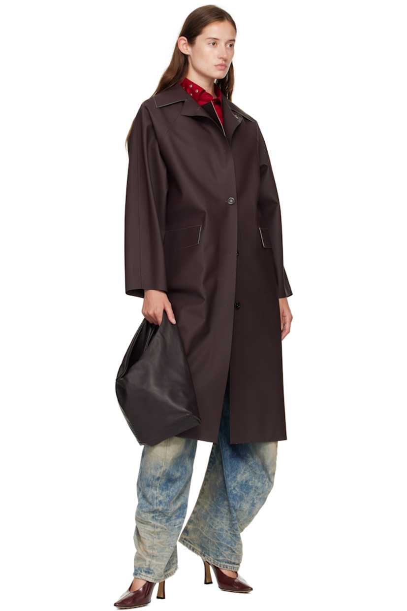 Grained lambskin tote.

· Integrated carry handle
· Bungee-style drawstring closure
· Partial satin twill lining
· H7" x W16.75" x D3"
· Total height: H12"

Supplier color: Dark brown