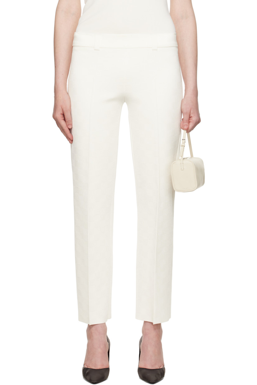 Viscose-blend jersey trousers. Jacquard check pattern throughout.

· Belt loops at rib-knit waistband
· Pinched seam at legs
· Mock pockets at back

Part of the exclusive SSENSE Bridal capsule.

Supplier color: Ivory