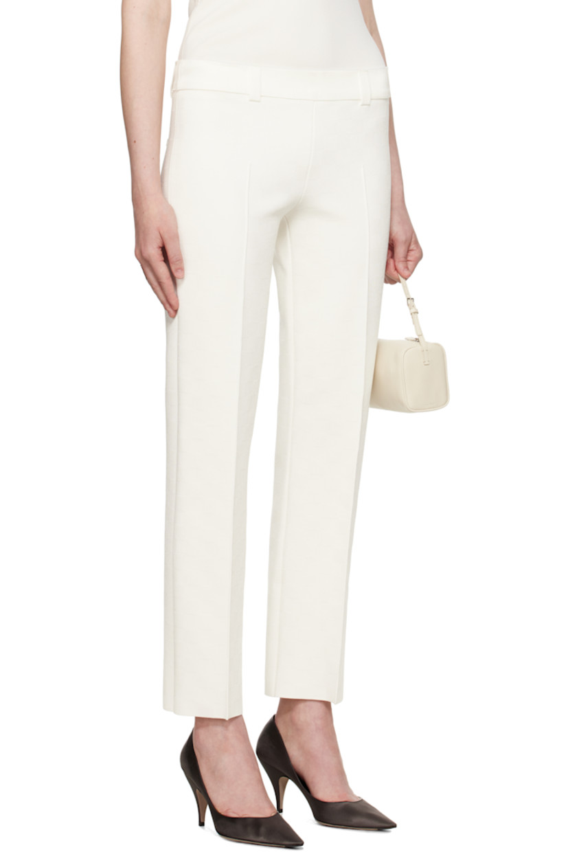 Viscose-blend jersey trousers. Jacquard check pattern throughout.

· Belt loops at rib-knit waistband
· Pinched seam at legs
· Mock pockets at back

Part of the exclusive SSENSE Bridal capsule.

Supplier color: Ivory